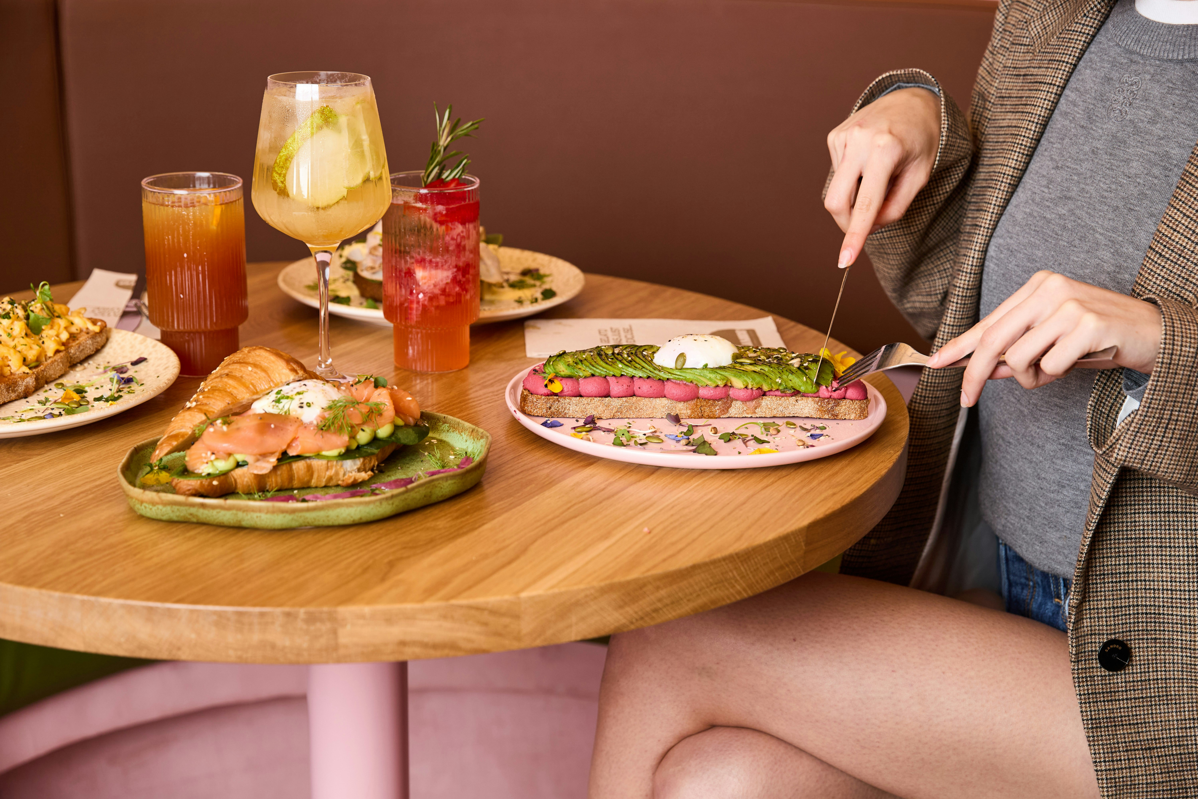 Person eating at a wooden table